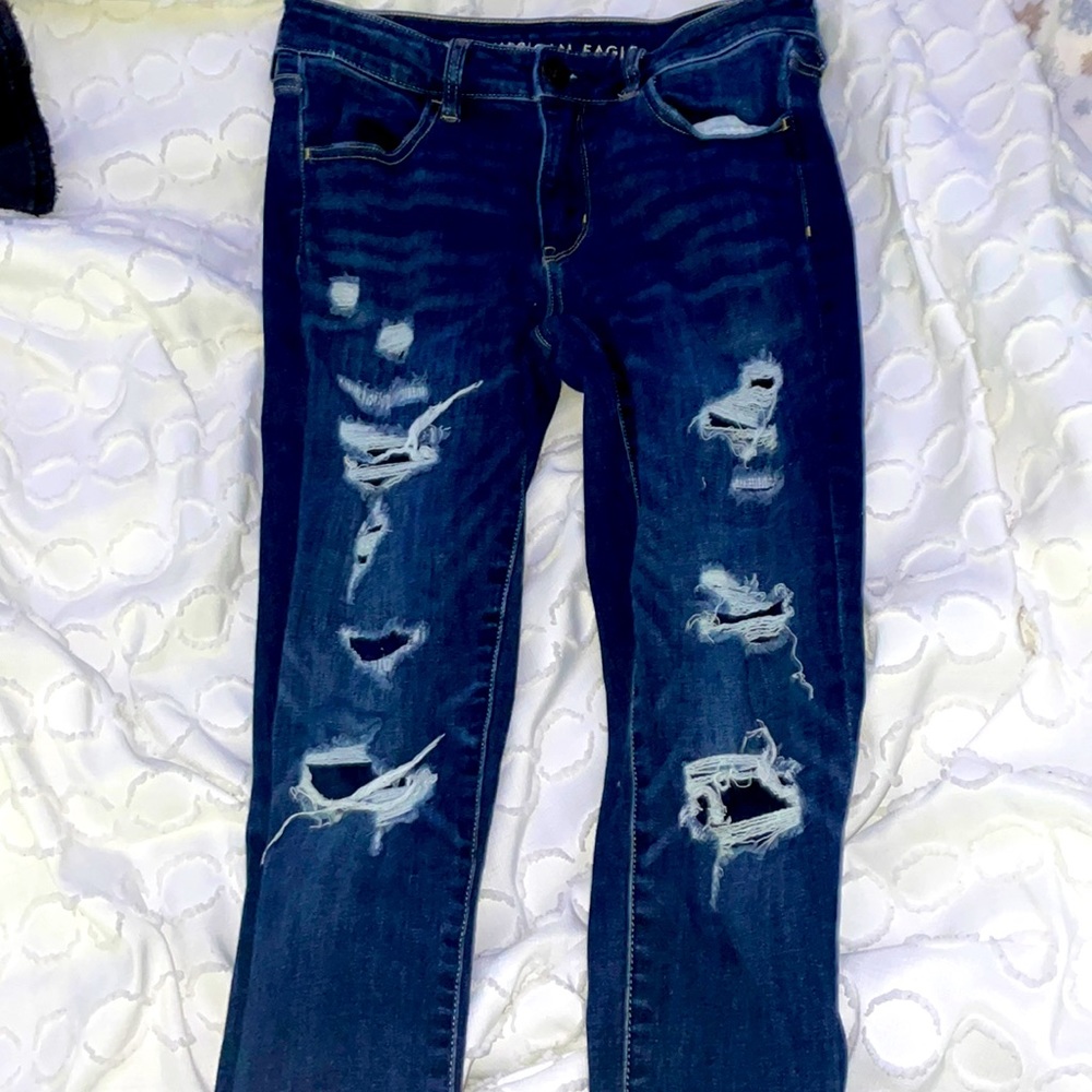 dark blue jeans with rips next level stretch american eagle